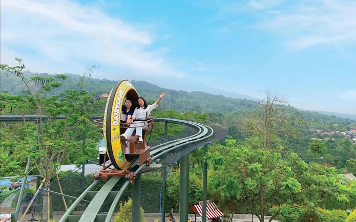 Sky Ride at Dairyland Farm Theme Park Prigen with two people enjoying the view.