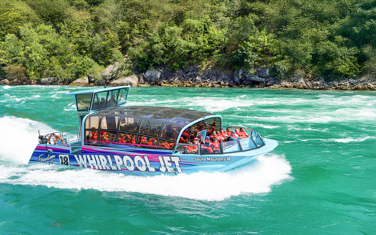 Guests on the Freedom jet boat tour in for a fun experience in the Niagara RIver Gorge in Niagara, Canada