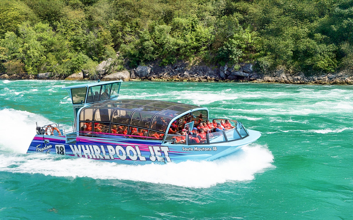 Guests enjoying the Freedom jet boat tour on the Niagara River Gorge, Niagara, Canada.