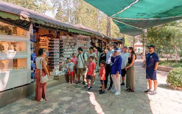Tourists exploring a souvenir shop in Antalya during a city sightseeing tour.