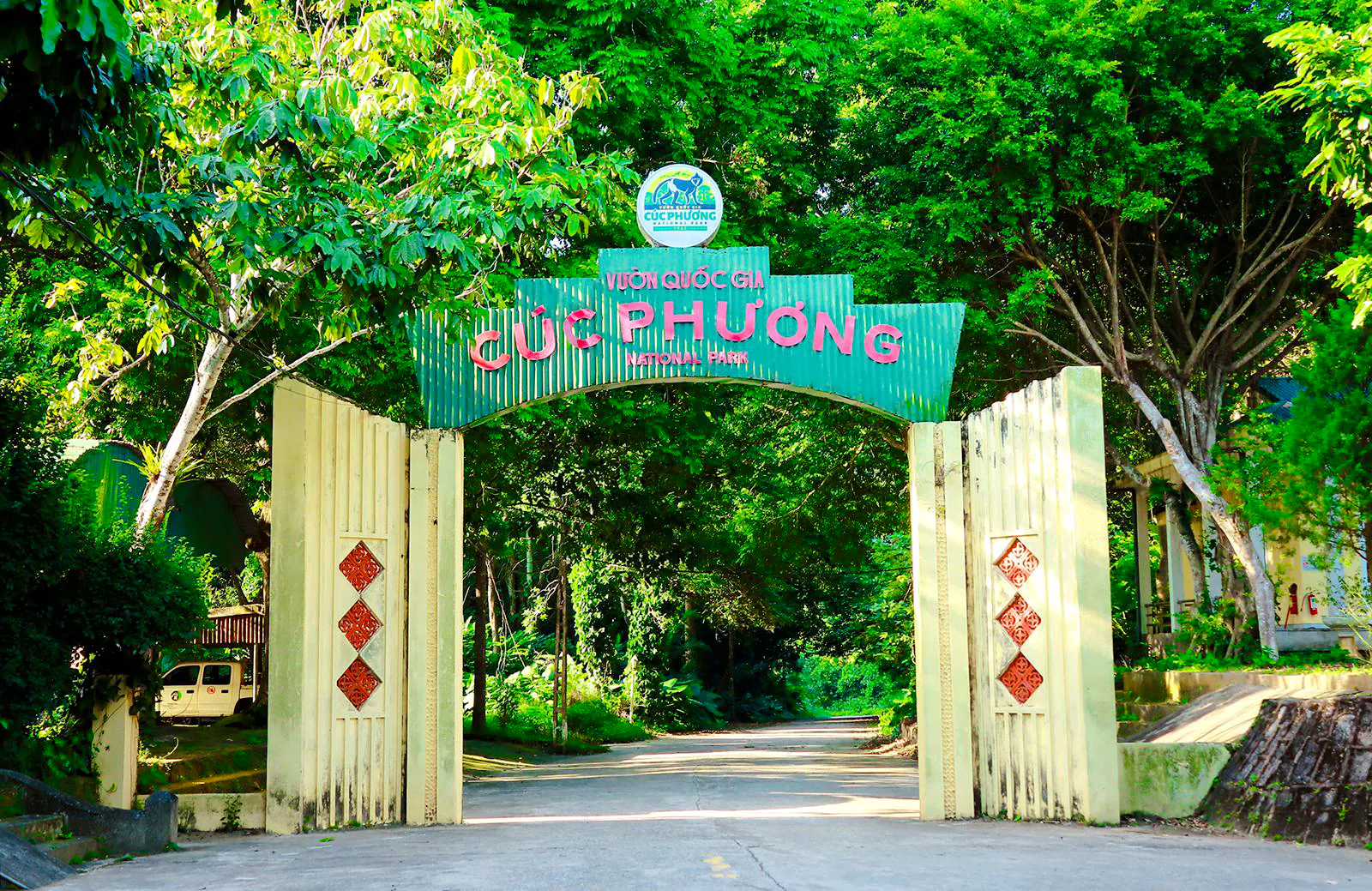 Entrance gate to Cuc Phuong National Park, surrounded by lush greenery, Ninh Binh.