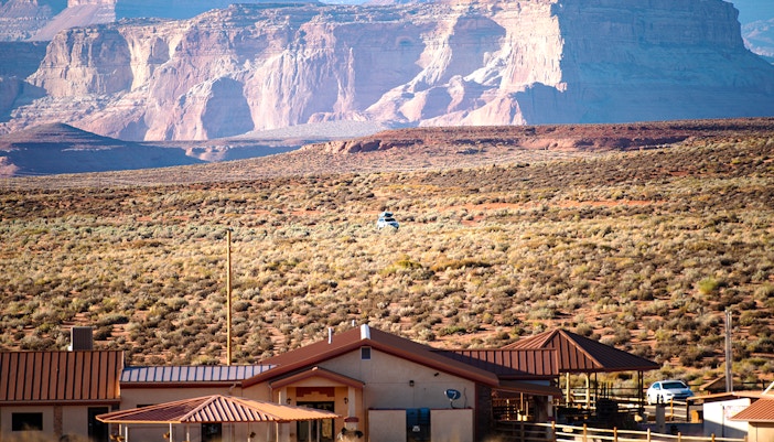 Grand Canyon Village view with tourists exploring the South Rim at Grand Canyon National Park.