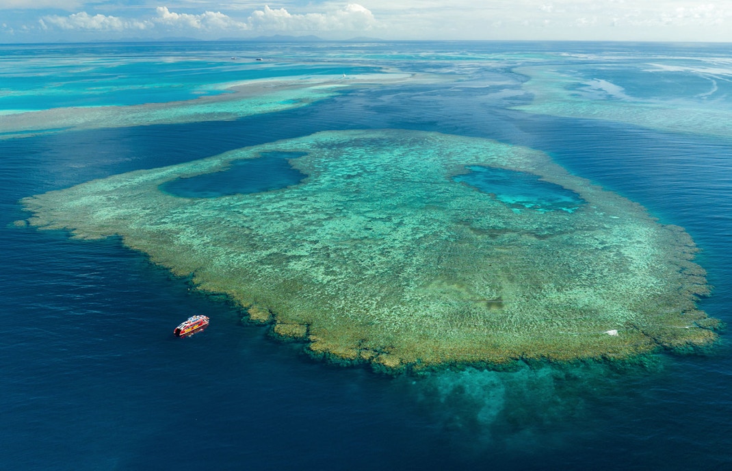 Aerial view of a boat near the Great Barrier Reef, Australia, for an Outer Reef Snorkel Adventure.
