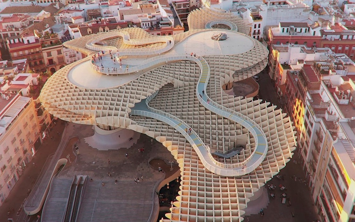 Aerial view of tourists walking on the Metropol Parasol in Seville, Spain.