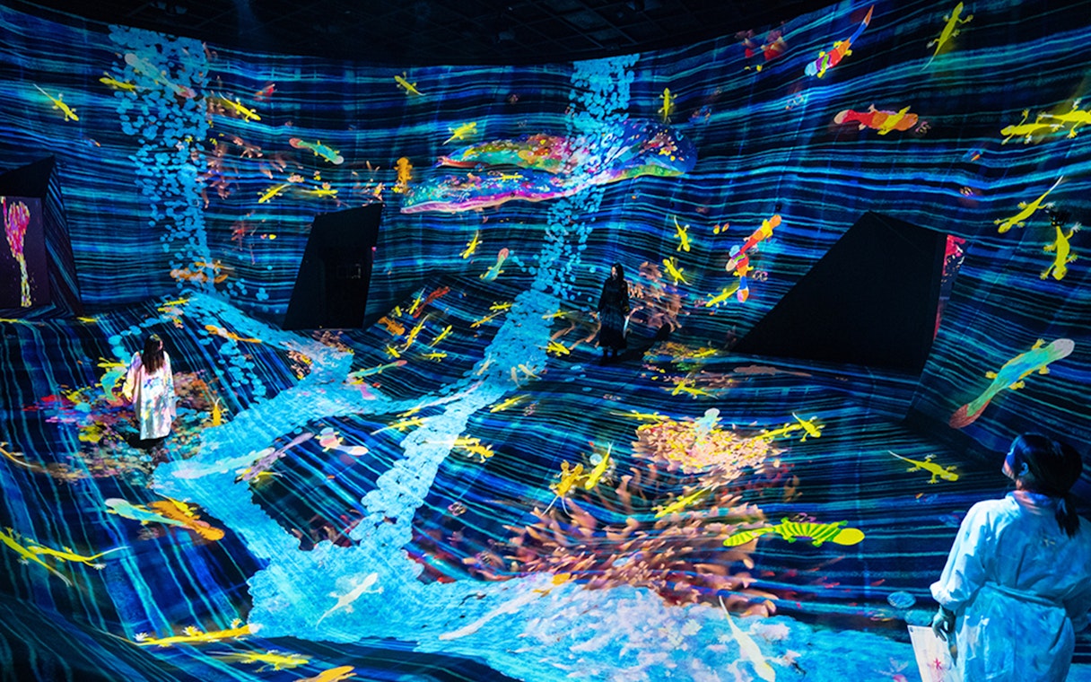 Immersive digital art installation at teamLab SuperNature Macau with colorful projections.