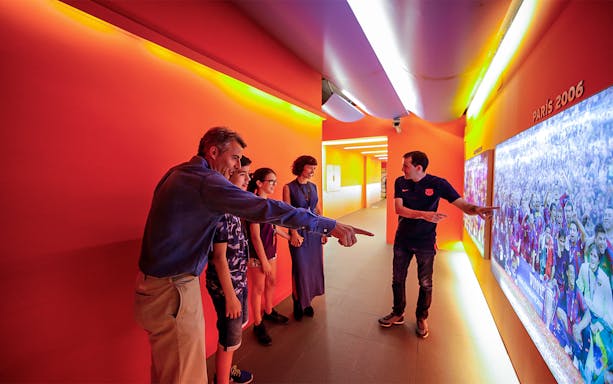 Visitors exploring FC Barcelona's Camp Nou Museum exhibit.