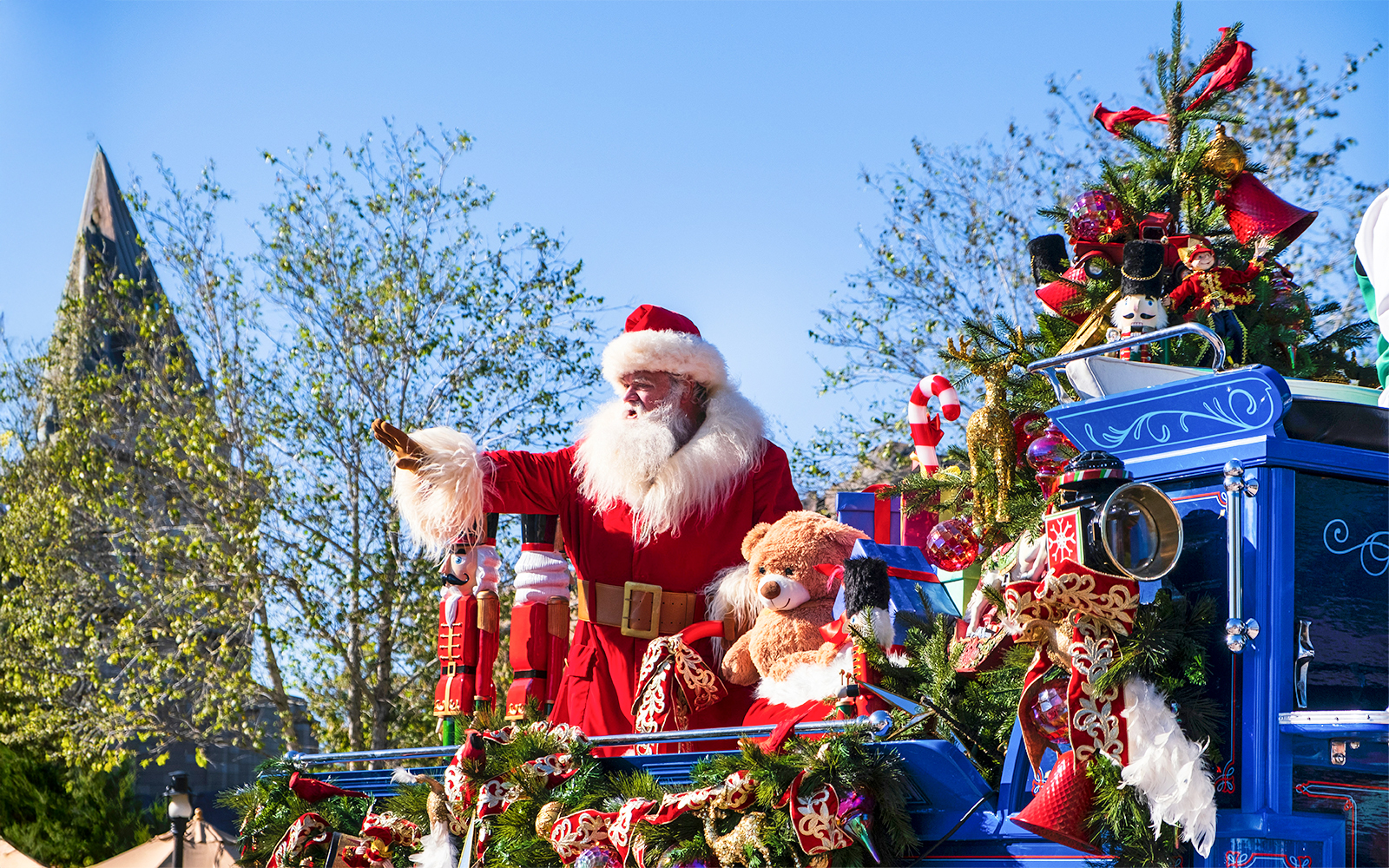 Santa Claus on a festive float at the Christmas Parade, Walt Disney World Orlando.