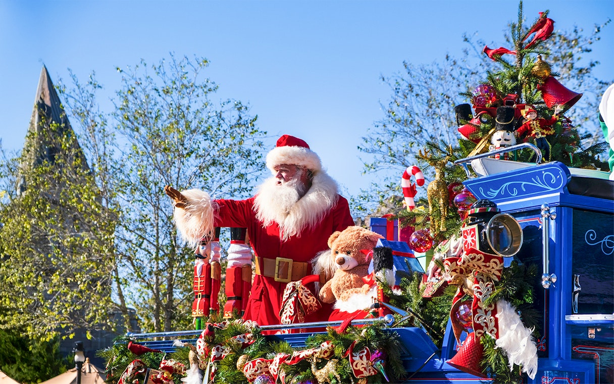 Santa Claus on a festive float at the Christmas Parade, Walt Disney World Orlando.