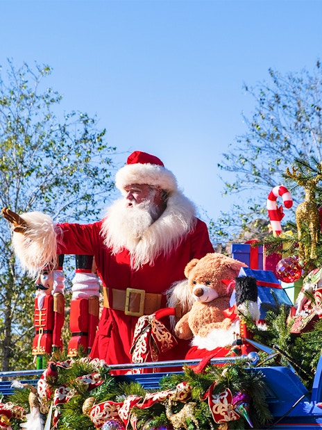 Santa Claus on a festive float at the Christmas Parade, Walt Disney World Orlando.