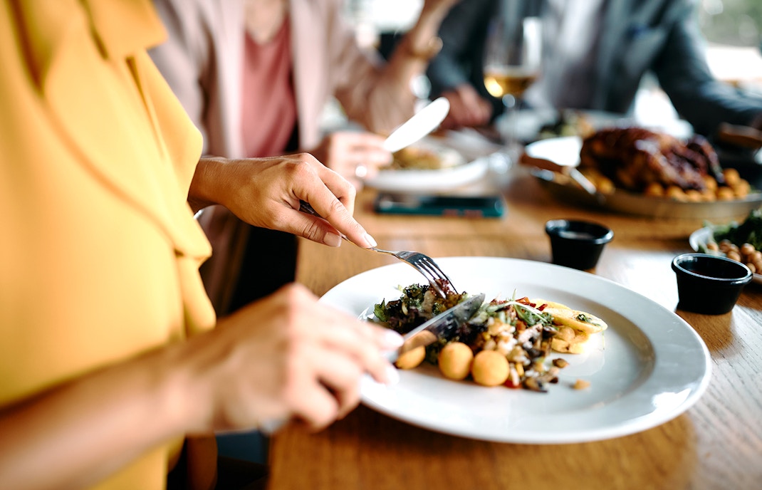 Dining experience with gourmet meal at a restaurant table.