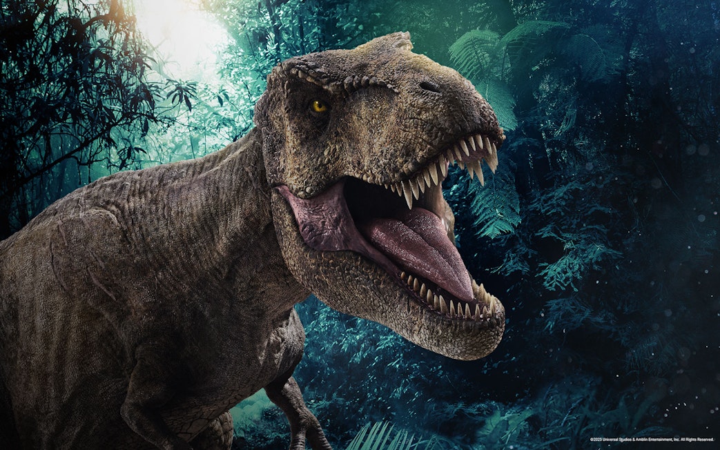 Tyrannosaurus rex roaring in a jungle setting at Jurassic World: The Experience.