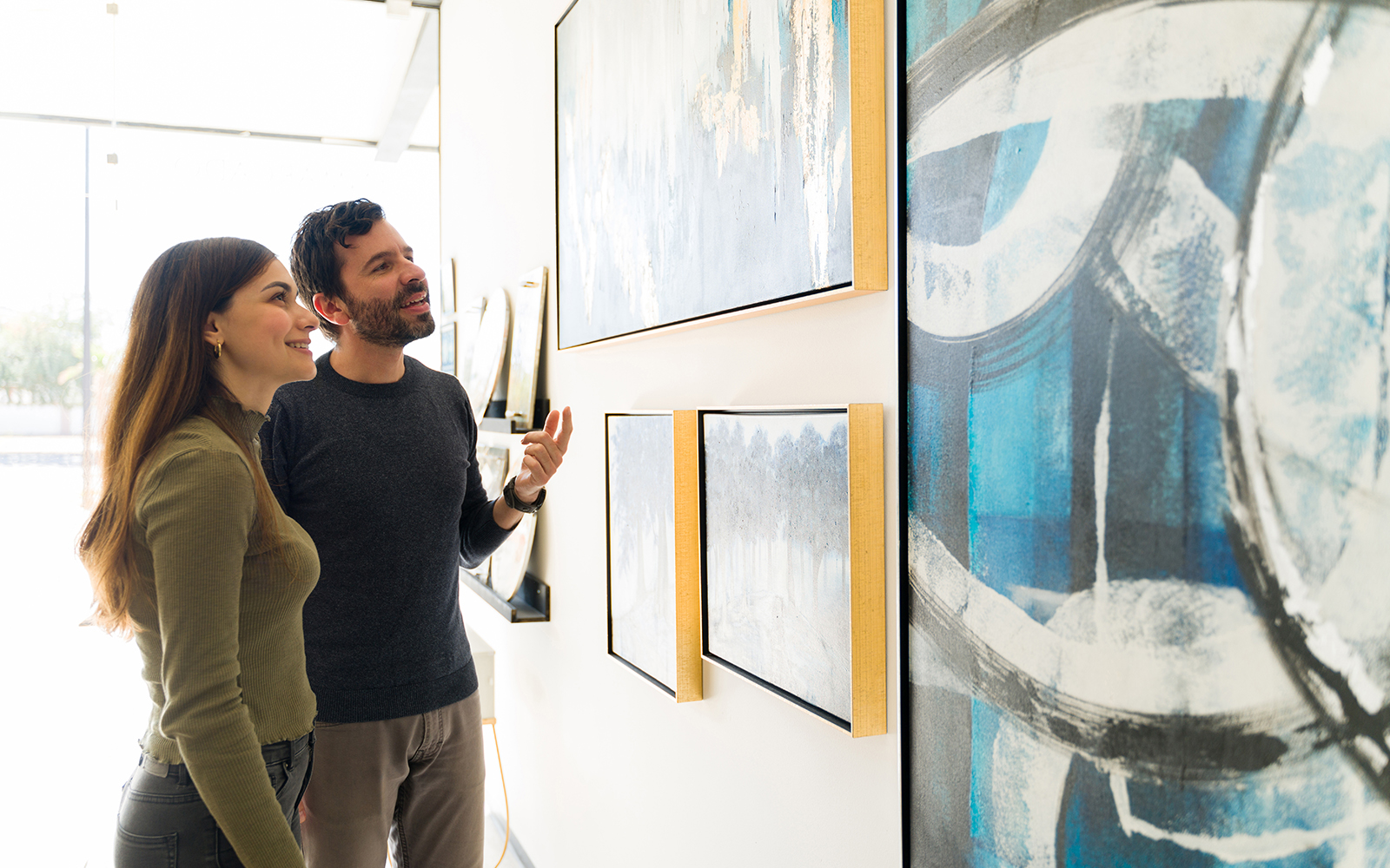 A couple in awe looking at the Henri Rousseau, The Dream Painting