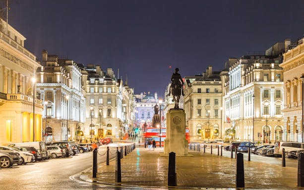 Trafalgar Square at night with Christmas lights in London.