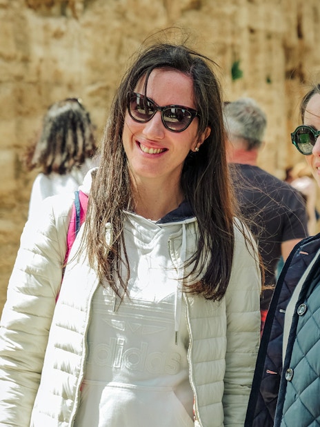 Visitors enjoying a guided tour at Paestum Archaeological Site in Italy.