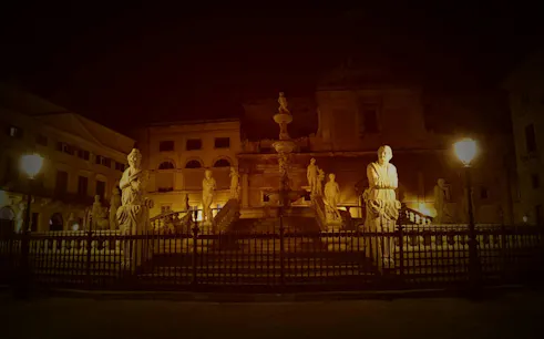Piazza Pretoria statues illuminated at night, Palermo, part of Haunted Palermo Vengeful Ghosts tour.