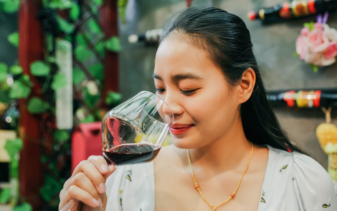 Guest enjoying wine tasting during Cappadocia vineyard tour.