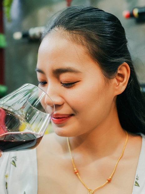 Guest enjoying wine tasting during Cappadocia vineyard tour.