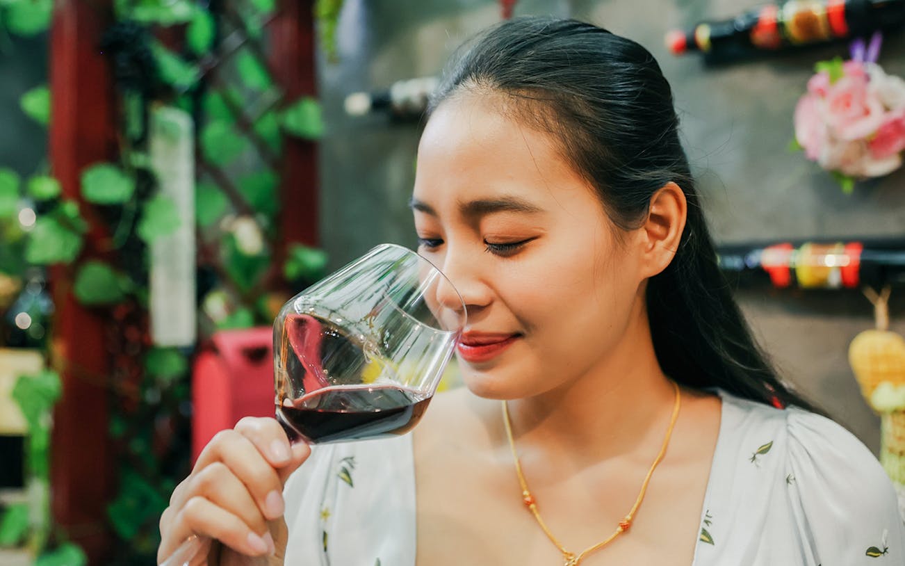 Guest enjoying wine tasting during Cappadocia vineyard tour.