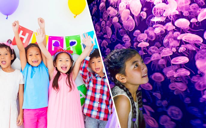 Children celebrating at KidZania with colorful balloons and a birthday banner.