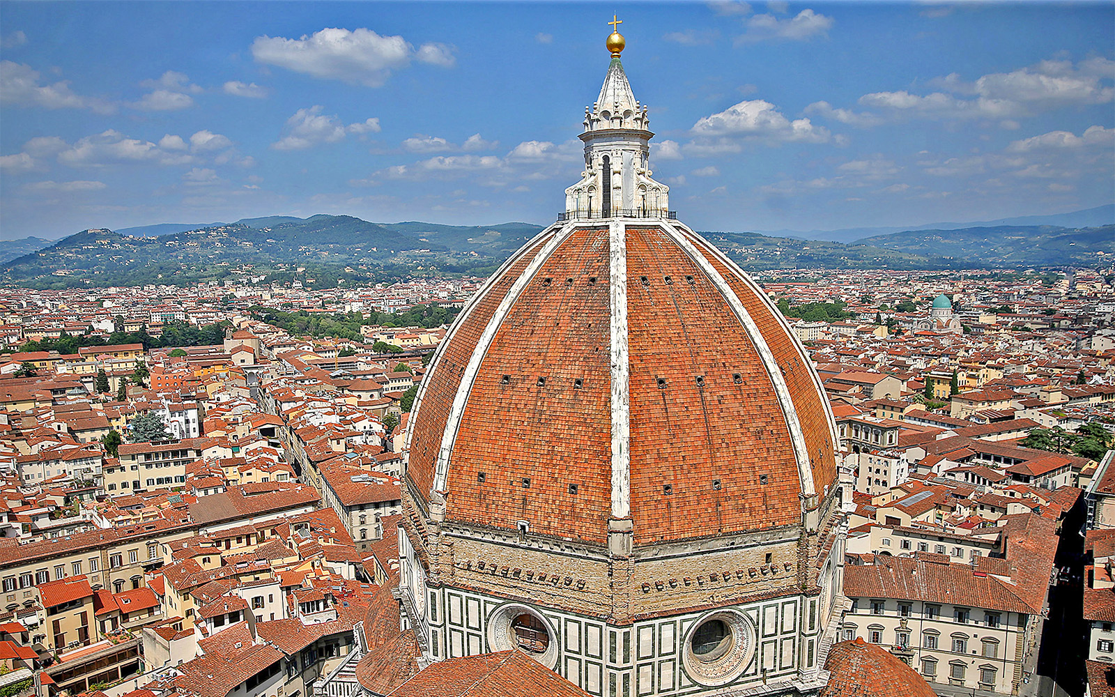 Duomo Florence dome with intricate architectural details and cityscape view.