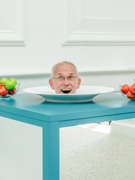 Head illusion on a table at Museum of Illusions Amsterdam.