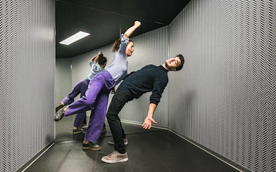Visitors experiencing the anti-gravity room at Illuseum Berlin.