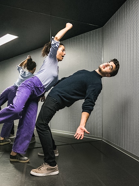 Visitors experiencing the anti-gravity room at Illuseum Berlin.