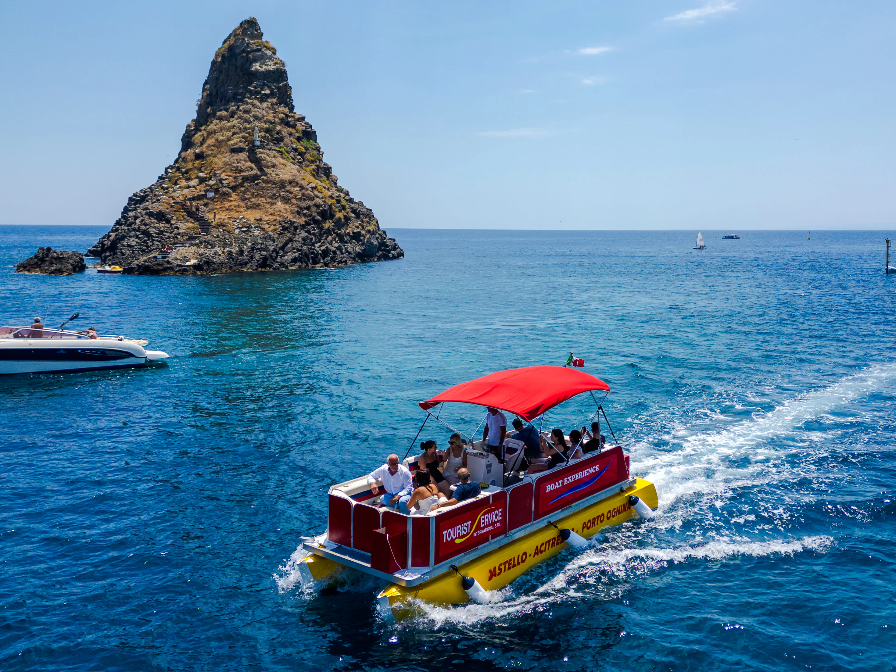 From Catania: Cyclops Coast Boat Tour with Welcome Aperitif and Swimming Stop