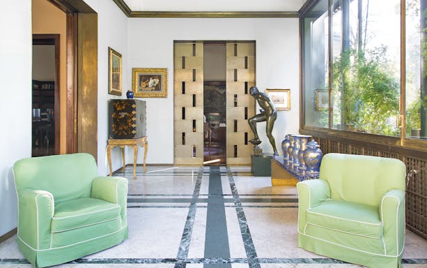 Villa Necchi Campiglio interior with art deco decor and sculpture on English guided tour.