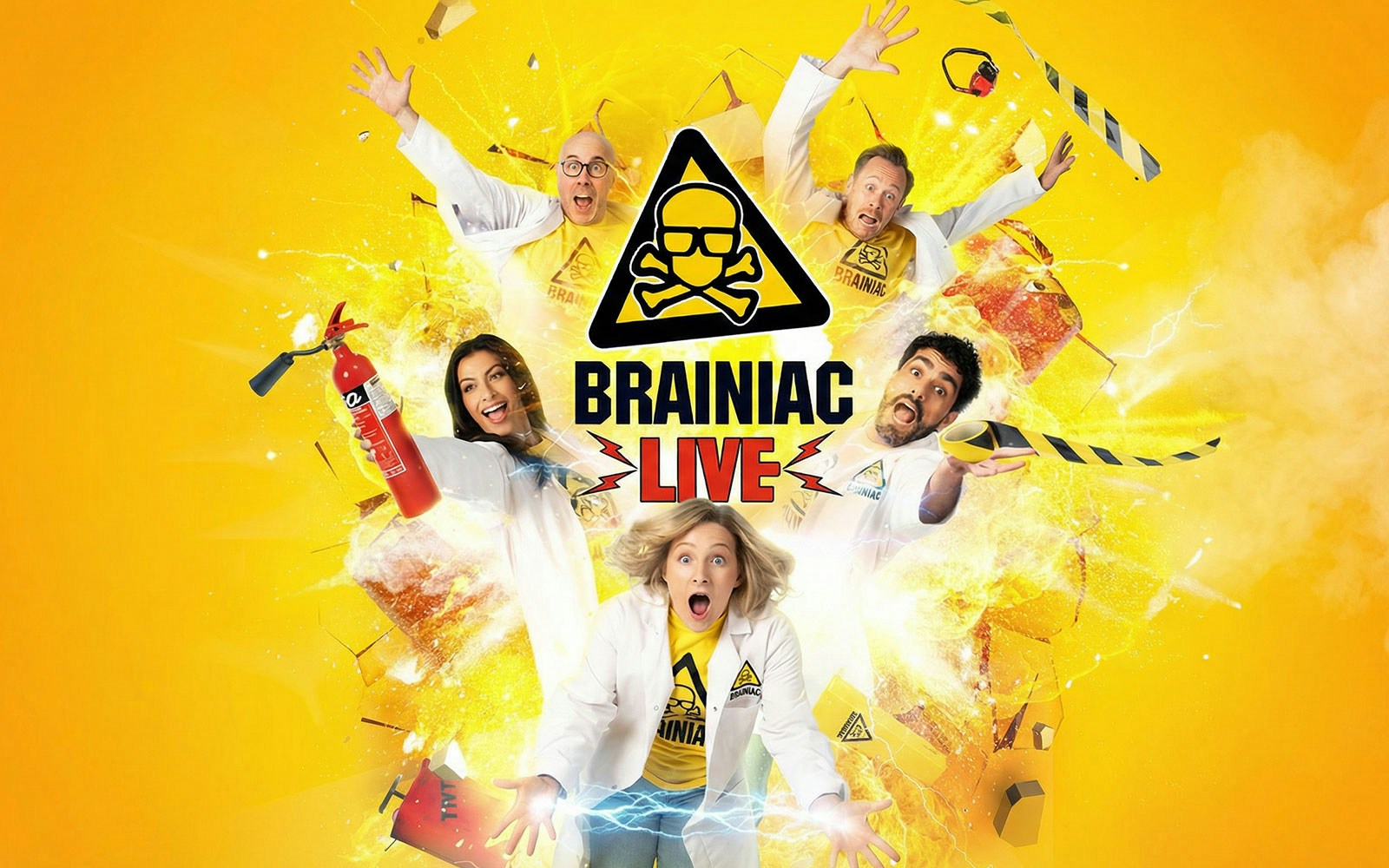 Performers in lab coats with explosive effects for Brainiac Live show.