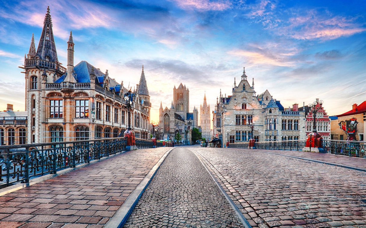 View from Sint-Michielsbrug in Ghent, Belgium, towards historic center with medieval architecture.