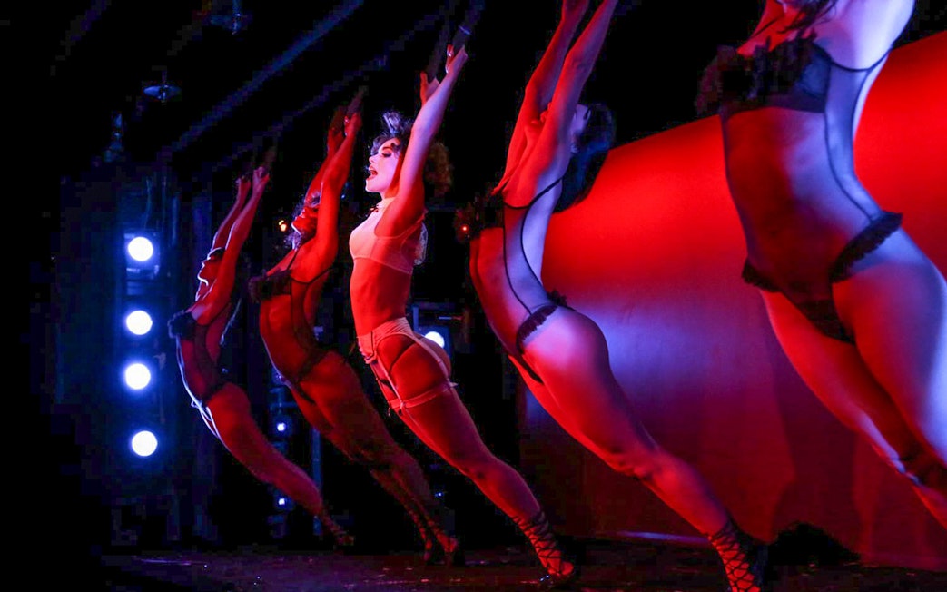 Performers on stage during Crazy Horse Show at Moulin Rouge, Paris.