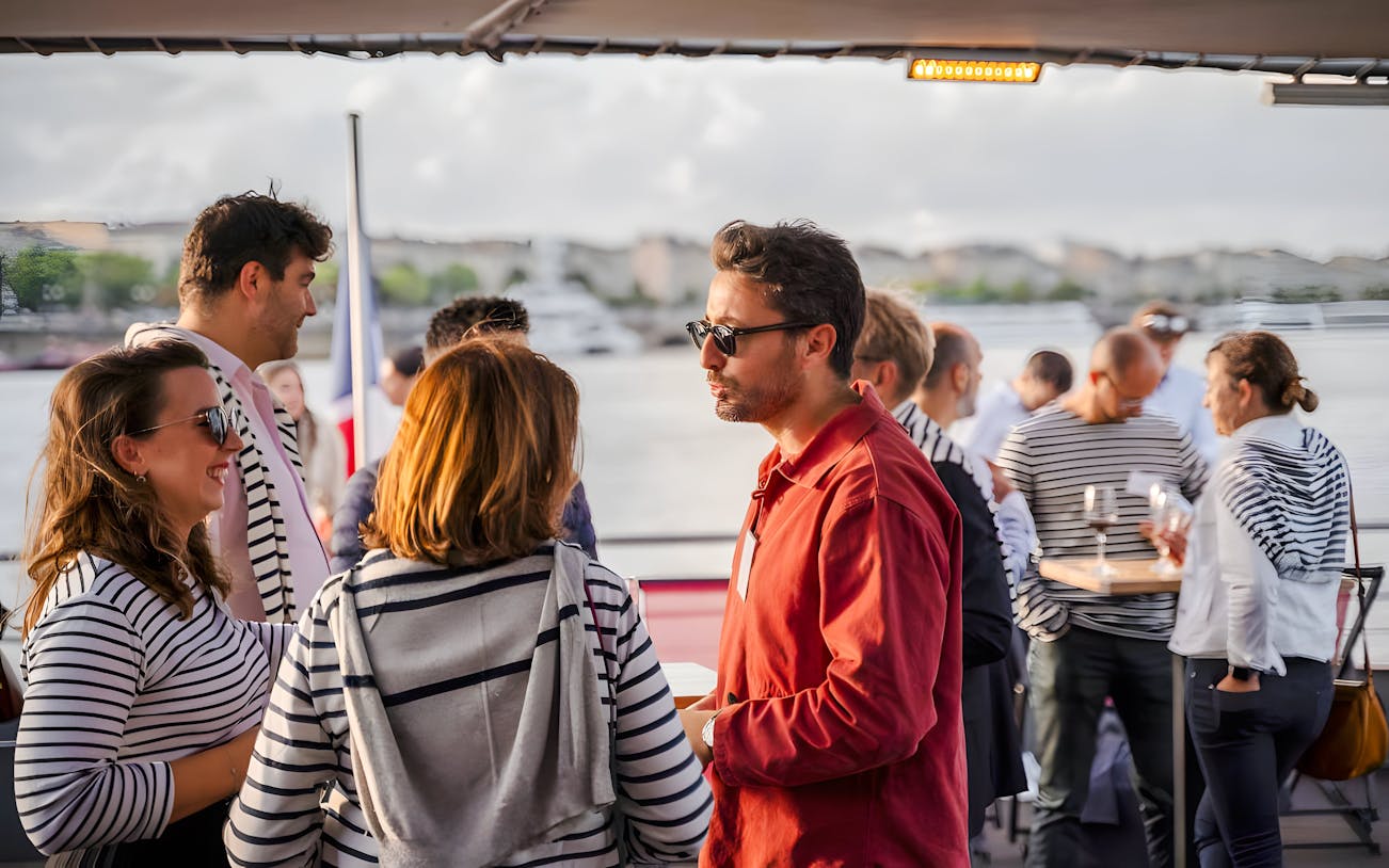 Guests socializing on the Bateaux Bordelais lunch cruise in Bordeaux, France.