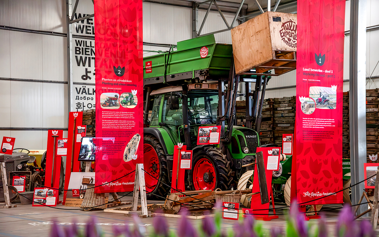 Exhibition display with tractor and informational panels at Keukenhof.