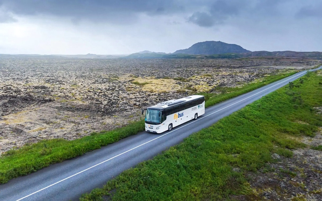 Bus traveling through Icelandic landscape en route to Blue Lagoon from Reykjavik/Keflavík Airport.