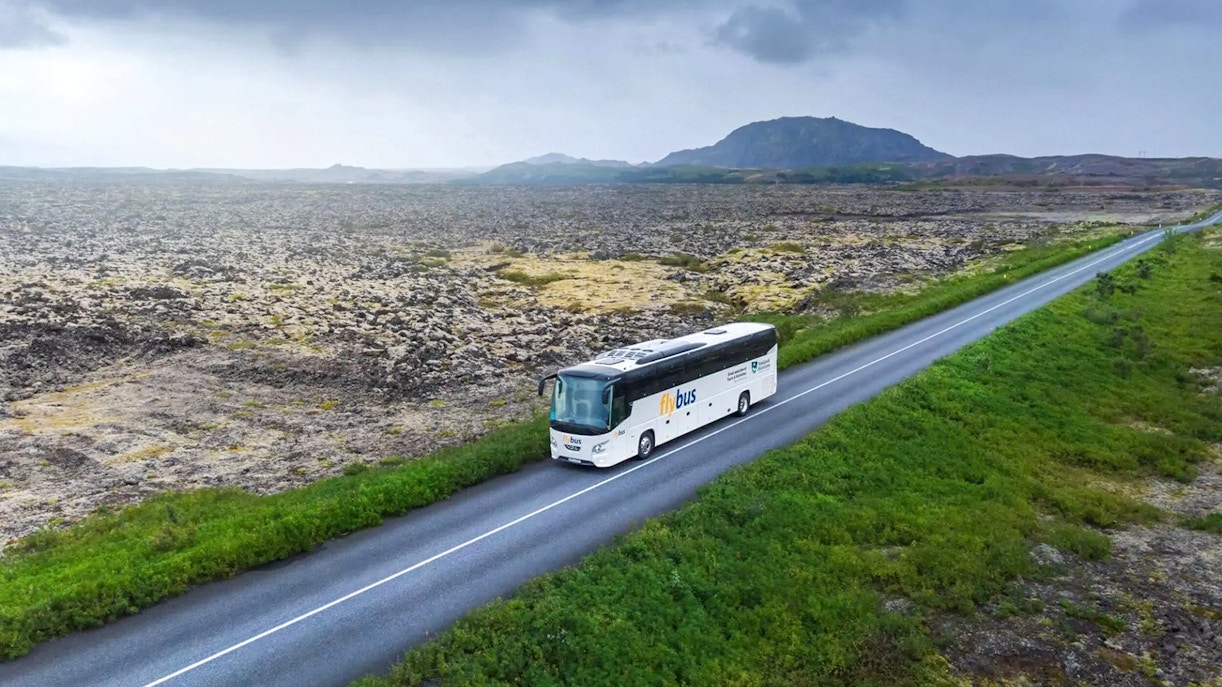 Bus traveling through Icelandic landscape