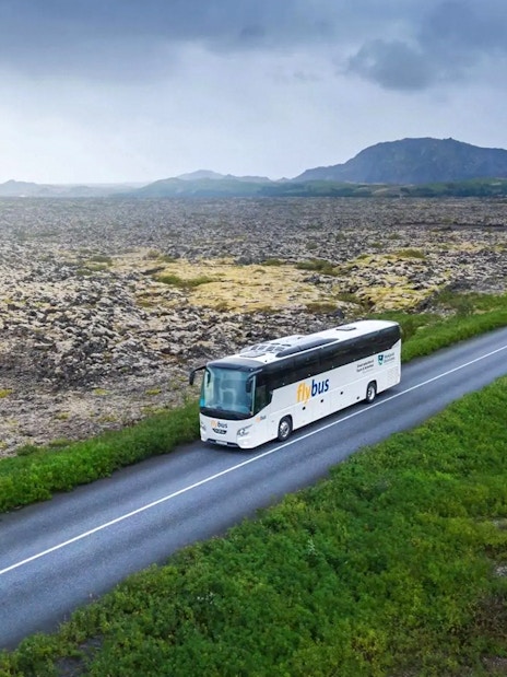 Bus traveling through Icelandic landscape en route to Blue Lagoon from Reykjavik/Keflavík Airport.