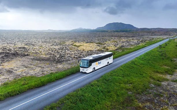 Bus traveling through Icelandic landscape en route to Blue Lagoon from Reykjavik/Keflavík Airport.