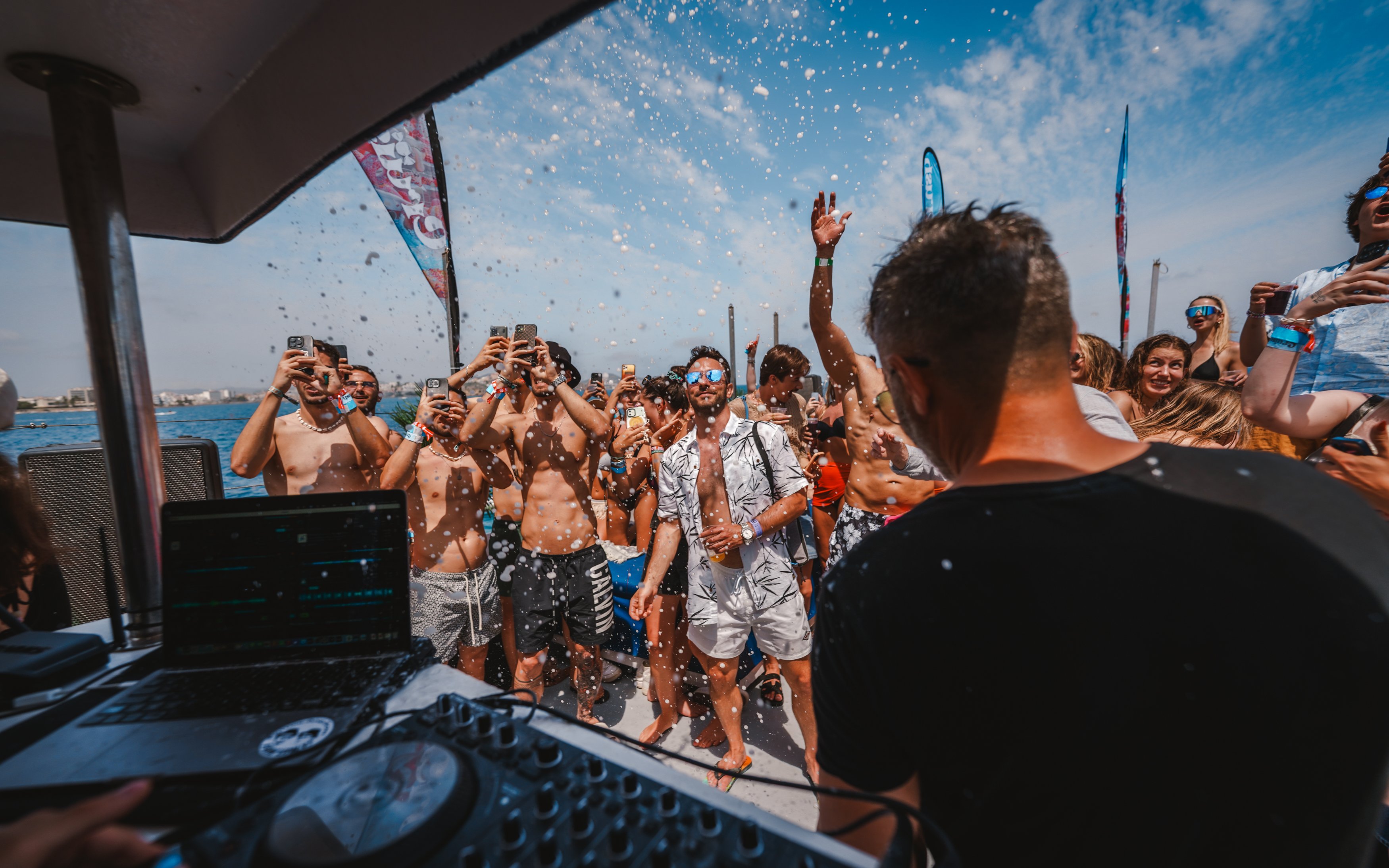 Tourists enjoying music and dancing on a Cruise Crush Boat Party.