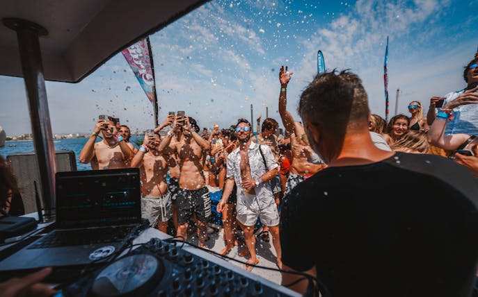 Tourists enjoying music and dancing on a Cruise Crush Boat Party.