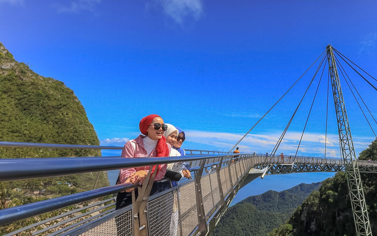 Friends enjoying the view on Langkawi Sky Bridge, Malaysia.