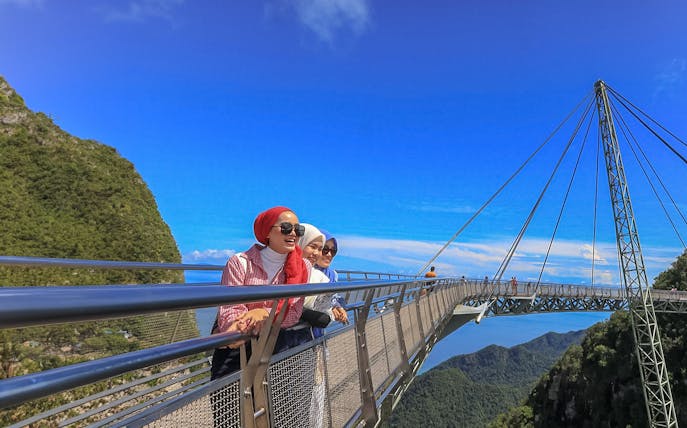 Friends enjoying the view on Langkawi Sky Bridge, Malaysia.