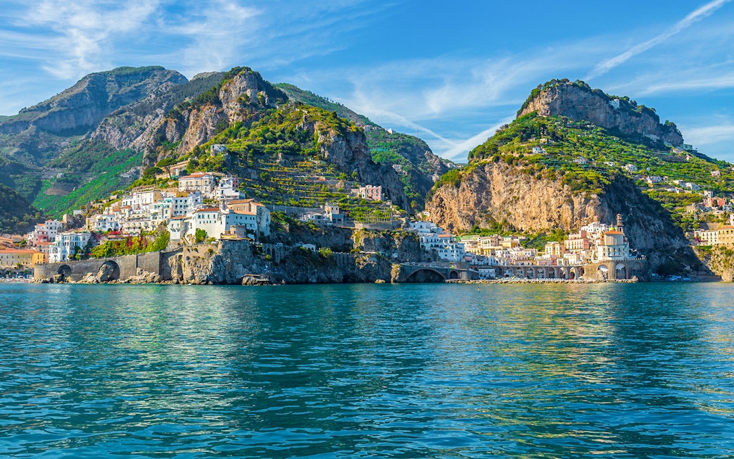 Coastal village with colorful buildings on cliffs, Amalfi Coast, Italy.