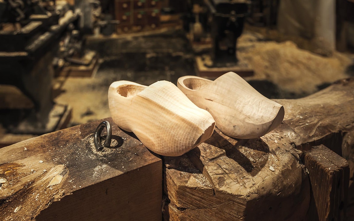 Wooden clogs on a workbench in Zaanse Schans, Netherlands.