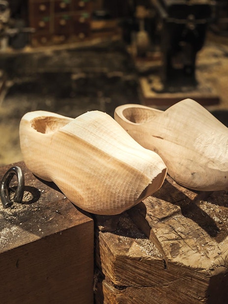 Wooden clogs on a workbench in Zaanse Schans, Netherlands.