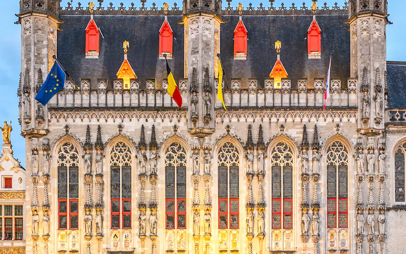 Stadhuis Brugge city hall in Burg Square, Belgium, with Gothic architecture.