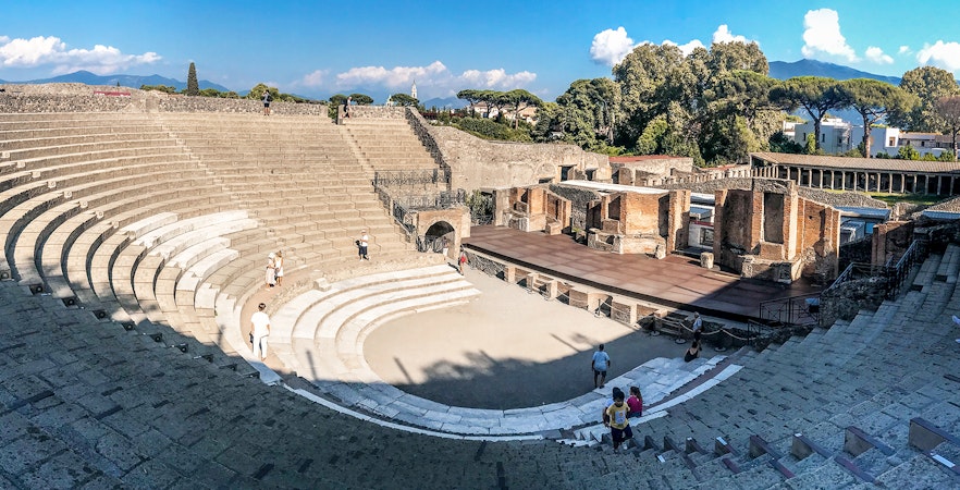 Ancient amphitheater in Pompeii with Mount Vesuvius in the background, Italy.