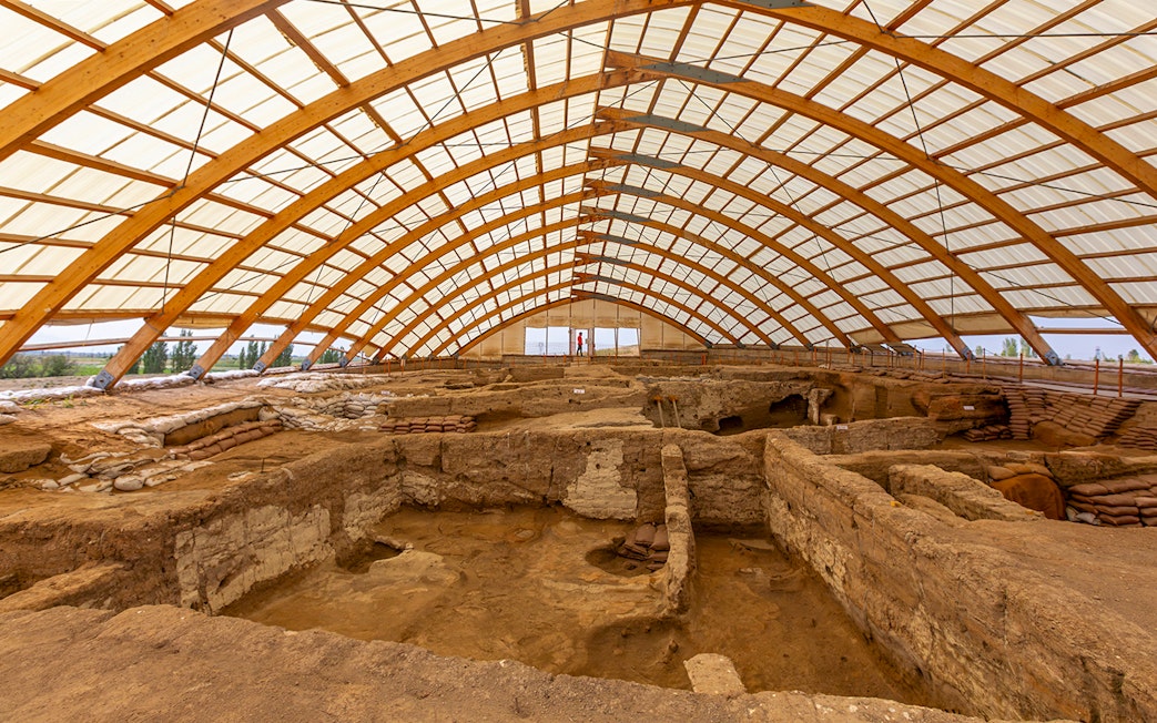 Inside view of Akrotiri Excavations in Santorini under protective structure.