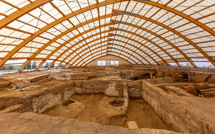 Inside view of Akrotiri Excavations in Santorini under protective structure.