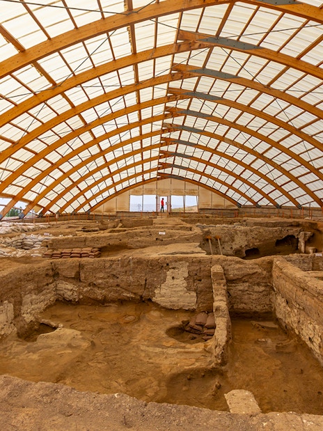 Inside view of Akrotiri Excavations in Santorini under protective structure.
